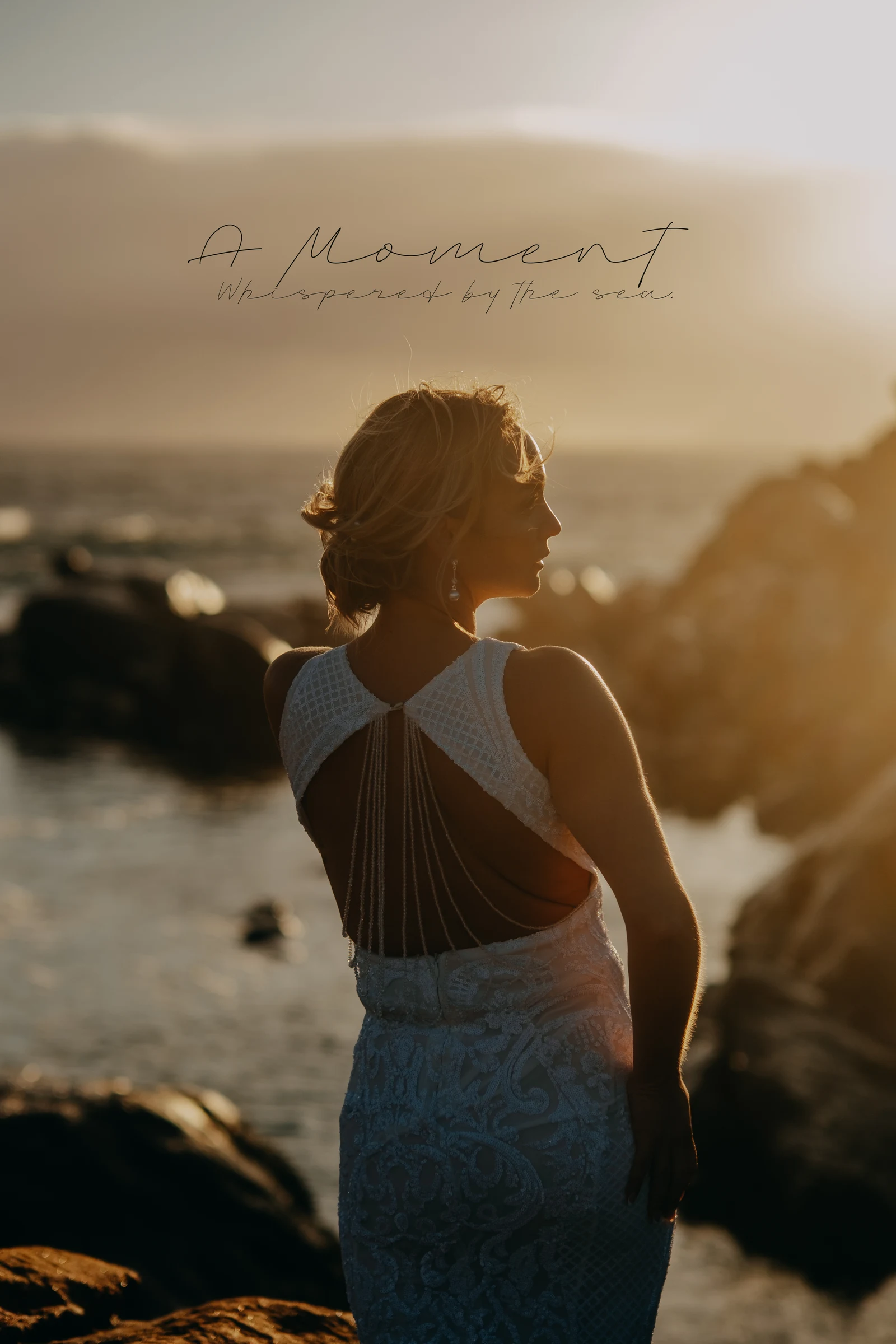 Stylised portrait of Victoria in her open-back dress at golden hour, overlaid with the words 'A Moment — Whispered by the sea'