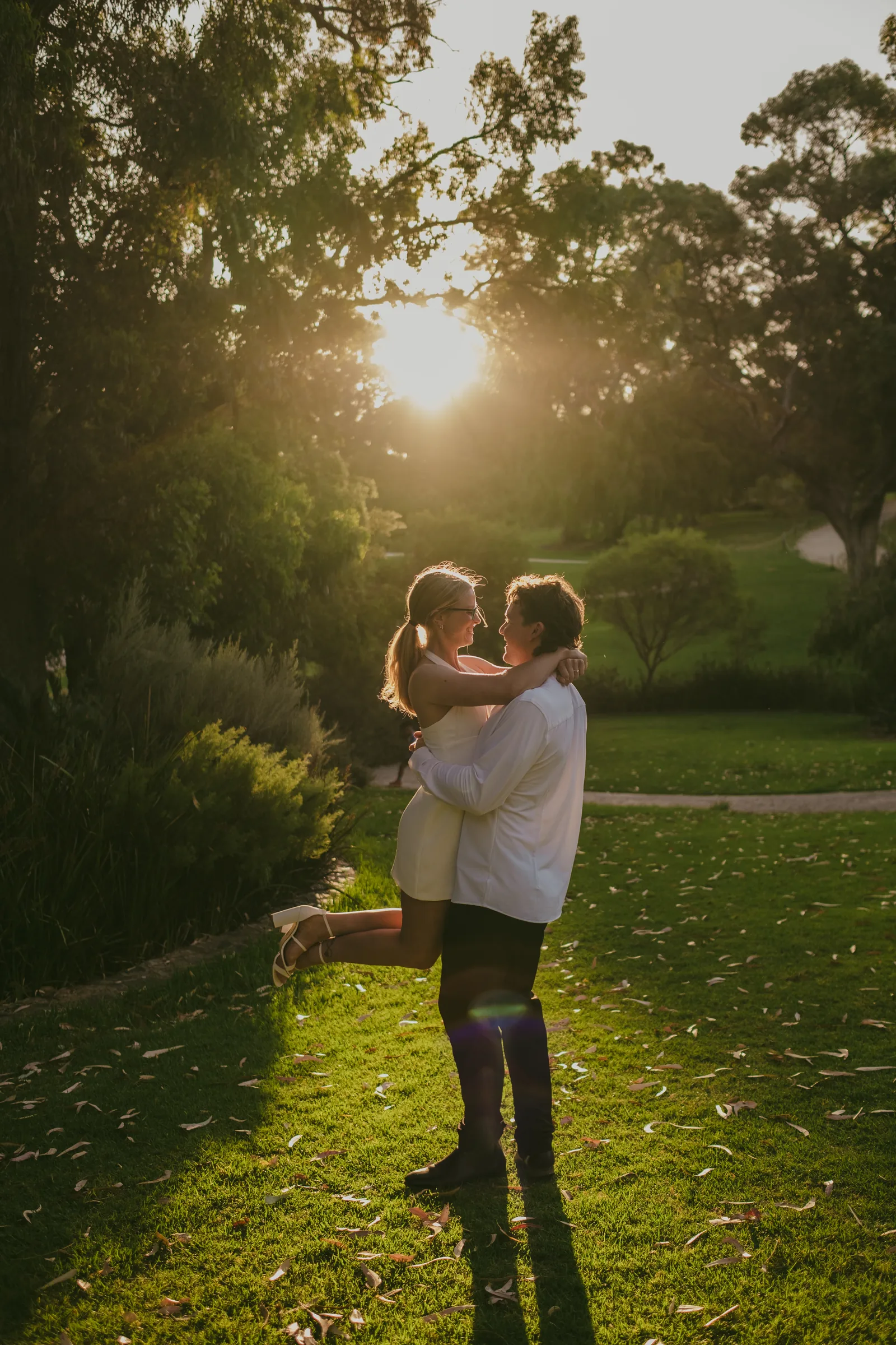 Brett lifting Kayla and spinning her as she laughs during their Kings Park pre-wedding session