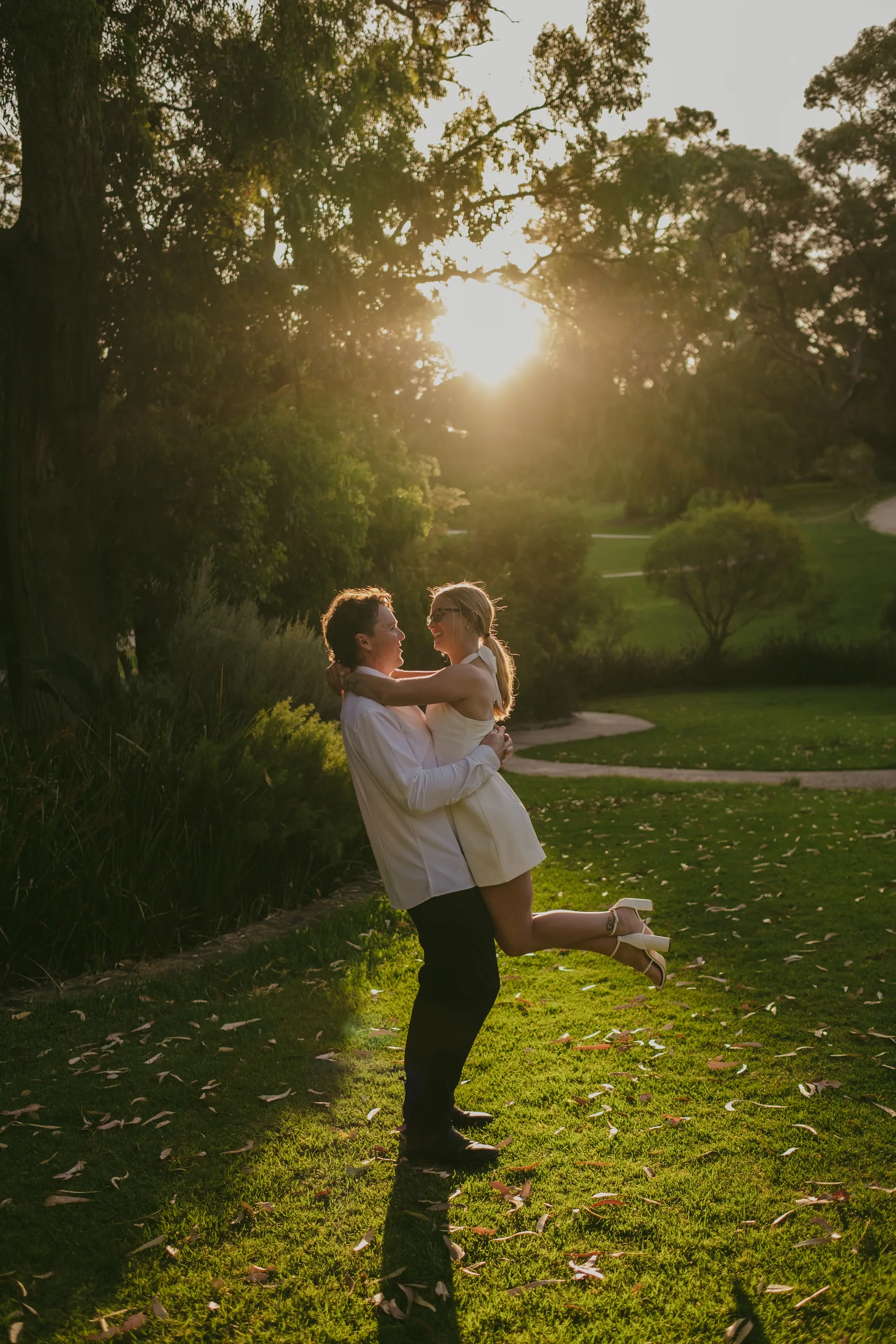 Brett spinning Kayla around as she laughs during their Kings Park pre-wedding photography session