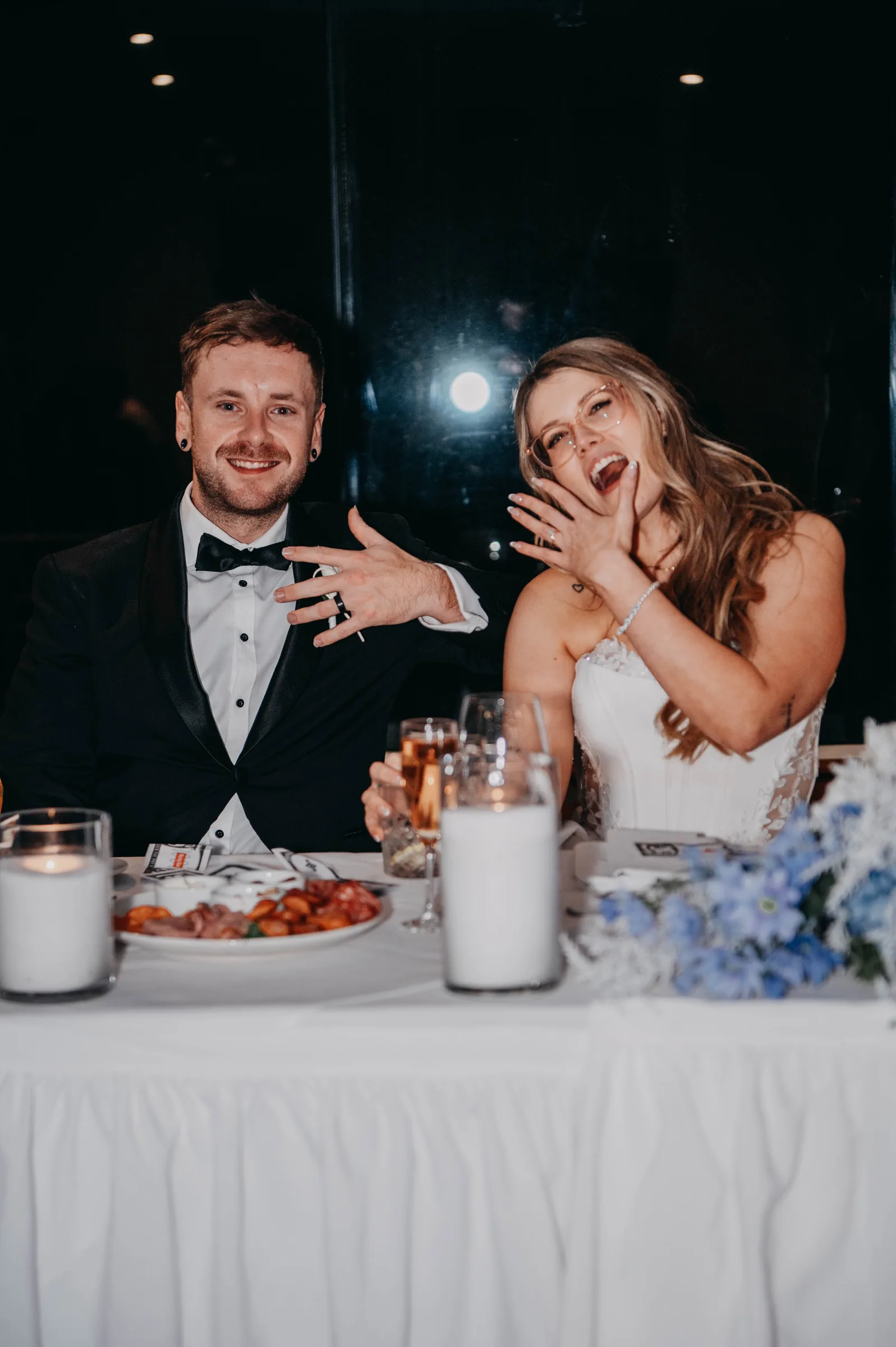 Kirra laughing during a speech at her wedding reception at The Vines Resort