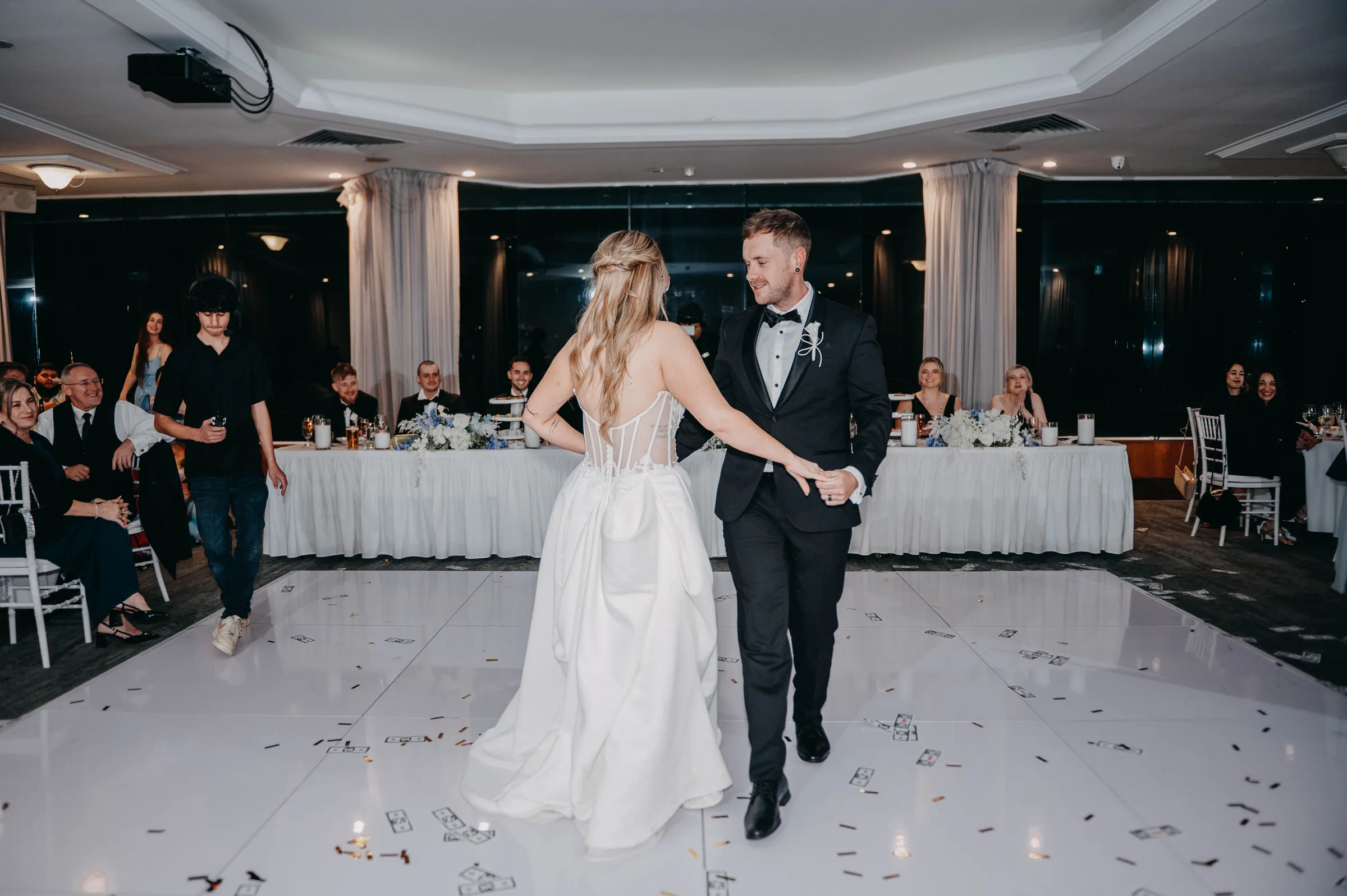 Kirra and Mitch's first dance on the confetti-covered dance floor at The Vines Resort