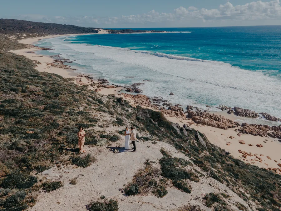Aerial drone view of Victoria and Luck's clifftop ceremony overlooking Injidup Beach